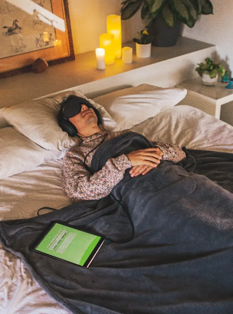 Man Laying in Bed Listening to Wavepaths